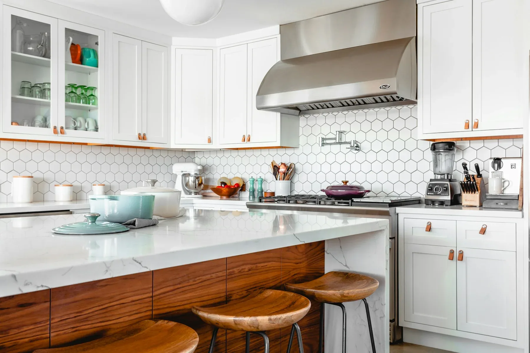 Bright kitchen with white cabinetry and warm timber details